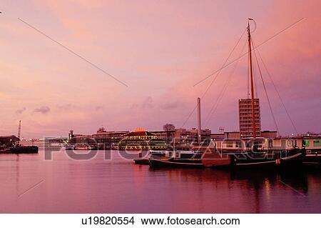 Amsterdam, The Netherlands, Holland, Europe, Sunset over Amsterdam's Harbor. View Large Photo Image Picture - Amsterdam, The Netherlands, Holland, Europe, Sunset over Amsterdam's Harbor.. Fotosearch