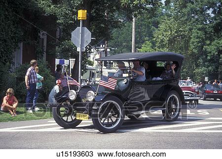 antique car, parade, Vermont, VT, People riding in an antique car at the Stowe Antique & Classic Car Meet Parade in Stowe. View Large Photo Image Stock Image - antique car, parade, Vermont, VT, People riding in an antique car at the Stowe Antique & Classic Car Meet Parade in Stowe.. Fotosearch