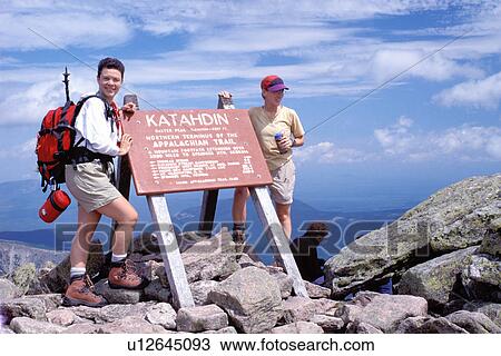 Appalachian Trail, Mt. Katahdin, Maine, Baxter Park, ME, backpacking, Two hikers pose for a picture at the Terminus of the Appalachian Trail on Mt. Katahdin in Baxter State Park. View Large Photo Image Stock Image - Appalachian Trail, Mt. Katahdin, Maine, Baxter Park, ME, backpacking, Two hikers pose for a picture at the Terminus of the Appalachian Trail on Mt. Katahdin in Baxter State Park. . Fotosearch