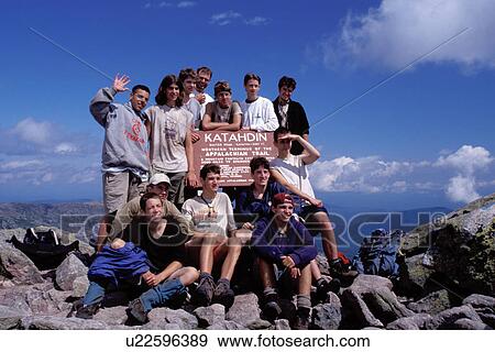 Stock Photo -  Appalachian Trail, Mt. Katahdin, Maine, Baxter Park, ME, backpacking, Hikers posing for picture at the Terminus of the Appalachian Trail on Mt. Katahdin in Baxter State Park. . Fotosearch