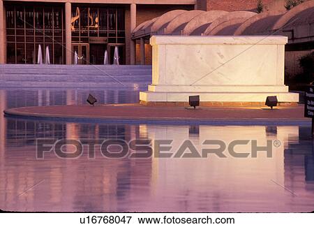Stock Photo -  Atlanta, MLK, Georgia, GA, Martin Luther King Jr. 's crypt illuminated in the reflecting pool in the evening at the Martin Luther King Jr. Center for Non-violent Social Change at the Martin Luther King Jr. National Historic Site.. Fotosearch