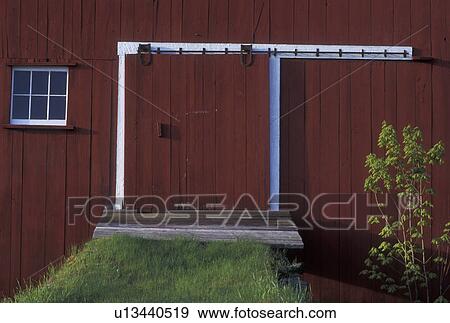 Stock Photo -  barn door, barn, spring, South Peacham, VT, Vermont, Close-up of red barn doors in the spring in South Peacham.. Fotosearch