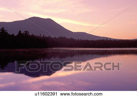 Baxter Park, Mt. Katahdin, Maine, sunrise, ME, sunset, Mt. Katahdin reflecting in the calm waters of Daicey Pond at sunrise in Baxter State Park. View Large Photo Image Stock Image - Baxter Park, Mt. Katahdin, Maine, sunrise, ME, sunset, Mt. Katahdin reflecting in the calm waters of Daicey Pond at sunrise in Baxter State Park. . Fotosearch