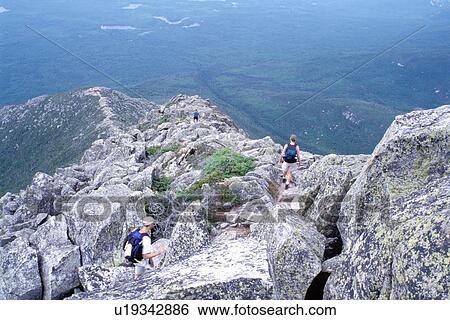 Stock Photograph -  Baxter Park, Mt. Katahdin, Maine, Appalachian Trail, ME, People hiking the rugged Hunt Trail part of the Appalachian Trail on Mt. Katahdin in Baxter State Park. . Fotosearch