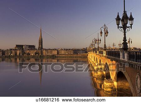 Stock Photograph -  Bordeaux, Aquitaine, Gironde, bridge, France, Europe, Pont de Pierre crosses the Garonne River into the city of Bordeaux. Fotosearch