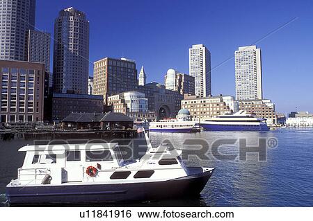 Stock Photograph -  Boston, MA, Massachusetts, Boat touring Boston Inner Harbor with a view of the skyline of downtown Boston.. Fotosearch