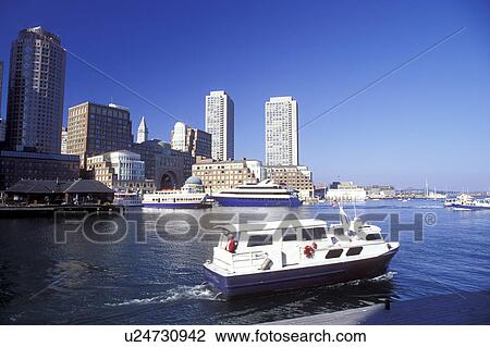 Stock Image -  Boston, Massachusetts, MA, Boat touring Boston Inner Harbor with a view of the skyline of downtown Boston.. Fotosearch