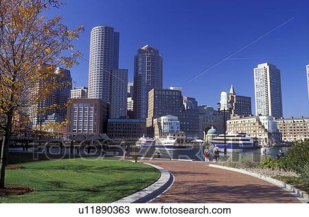 Stock Image -  Boston, Massachusetts, MA, View of the downtown skyline of Boston from Boston Inner Harbor from a city park in the fall.. Fotosearch