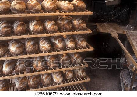 bread, bakery, French bread, fresh, Freshly baked country loaves are displayed on the wooden cooling racks at Gerard's Bakery in Westford in the state of Vermont. View Large Photo Image Stock Photo - bread, bakery, French bread, fresh, Freshly baked country loaves are displayed on the wooden cooling racks at Gerard's Bakery in Westford in the state of Vermont. . Fotosearch