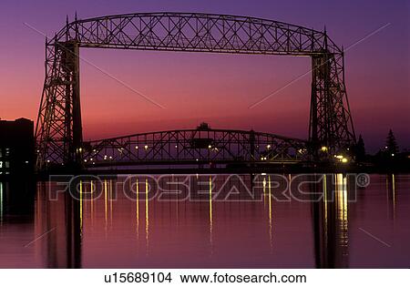 bridge, lift bridge, Duluth, MN, Minnesota, Aerial Lift Bridge, 386 feet long, at sunrise spans the Duluth Harbor on Lake Superior in Duluth. View Large Photo Image Picture - bridge, lift bridge, Duluth, MN, Minnesota, Aerial Lift Bridge, 386 feet long, at sunrise spans the Duluth Harbor on Lake Superior in Duluth.. Fotosearch