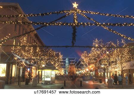 Stock Photo -  Burlington, decorations, Christmas, pedestrian street, city, winter, snow, Vermont, Church Street Marketplace in downtown Burlington is decorated for the Christmas holiday season at night in Chittenden County in the state of Vermont. . Fotosearch