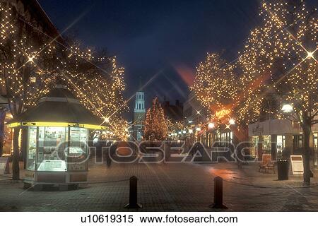 Stock Photography -  Burlington, decorations, pedestrian street, city, Christmas, winter, snow, Vermont, Church Street Marketplace in downtown Burlington is decorated for the Christmas holiday season at night in Chittenden County in the state of Vermont. . Fotosearch