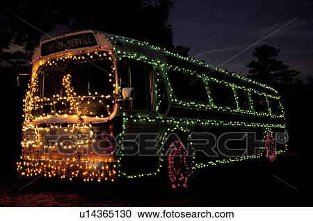 Stock Image -  bus, Georgia, GA, Atlanta, Colorful Christmas lights decorate a large bus at Georgia's Stone Mountain Park.. Fotosearch