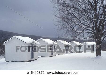Stock Image -  cabins, winter, Marshfield, Vermont, VT, Wallinda Cabins covered with snow in winter in Marshfield.. Fotosearch