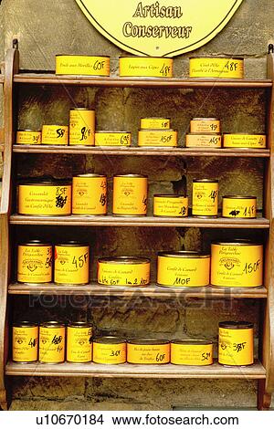 Picture -  can, food, goose liver, foie gras, France, Perigord, Dordogne, Aquitaine, Europe, Sarlet-la-Caneda, Cans of foie gras (goose liver) are displayed on a shelf in a store in the medieval village of Sarlet-la-Caneda. . Fotosearch