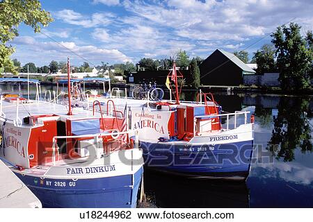 Stock Image -  canal barge, Seneca Falls, Finger Lakes, New York, NY, Cruise line boats along the Cayuga-Seneca Canal.. Fotosearch