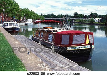 Stock Photography -  canal, Seneca Falls, NY, New York, Finger Lakes, Canal boats moored along the Cayuga-Seneca Canal.. Fotosearch