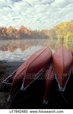 canoe, North Carolina, NC, Red canoes rest upsidedown on the misty Price Lake at Julian Price Memorial Park in the fall. View Large Photo Image Stock Image - canoe, North Carolina, NC, Red canoes rest upsidedown on the misty Price Lake at Julian Price Memorial Park in the fall.. Fotosearch
