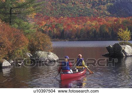 canoeing, autumn, canoe, Vermont, VT, Mother and daughter paddle a red canoe on Marshfield Pond in the fall. View Large Photo Image Picture - canoeing, autumn, canoe, Vermont, VT, Mother and daughter paddle a red canoe on Marshfield Pond in the fall. . Fotosearch