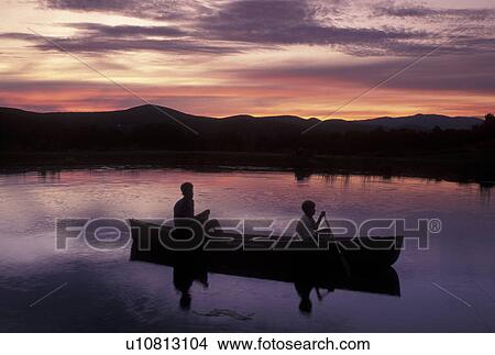canoeing, canoe, sunrise, Vermont, VT, Silhouette of a father and son in a canoe at sunset in Montpelier. View Large Photo Image Picture - canoeing, canoe, sunrise, Vermont, VT, Silhouette of a father and son in a canoe at sunset in Montpelier.. Fotosearch