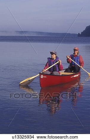 canoeing, canoe, Vermont, VT, Mother and daughter paddling a red canoe on Lake Willoughby in Westmore View Large Photo Image Picture - canoeing, canoe, Vermont, VT, Mother and daughter paddling a red canoe on Lake Willoughby in Westmore. Fotosearch