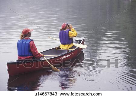 canoeing, canoe, Vermont, VT, Mother and daughter paddle a red canoe on Kettle Pond in Groton State Forest. Daughter looks through binoculars. View Large Photo Image Stock Image - canoeing, canoe, Vermont, VT, Mother and daughter paddle a red canoe on Kettle Pond in Groton State Forest. Daughter looks through binoculars.. Fotosearch