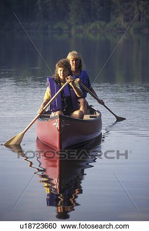 canoeing, canoe, Vermont, VT, Mother and daughter paddling a red canoe on Kettle Pond in Groton State Forest. View Large Photo Image Stock Image - canoeing, canoe, Vermont, VT, Mother and daughter paddling a red canoe on Kettle Pond in Groton State Forest.. Fotosearch