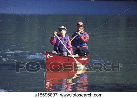 canoeing, canoe, Vermont, VT, Mother and daughter paddling a red canoe on Lake Willoughby in Westmore View Large Photo Image Stock Photo - canoeing, canoe, Vermont, VT, Mother and daughter paddling a red canoe on Lake Willoughby in Westmore. Fotosearch