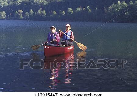 canoeing, canoe, Vermont, VT, Mother and daughter paddling a red canoe on Lake Willoughby in Westmore View Large Photo Image Stock Photo - canoeing, canoe, Vermont, VT, Mother and daughter paddling a red canoe on Lake Willoughby in Westmore. Fotosearch