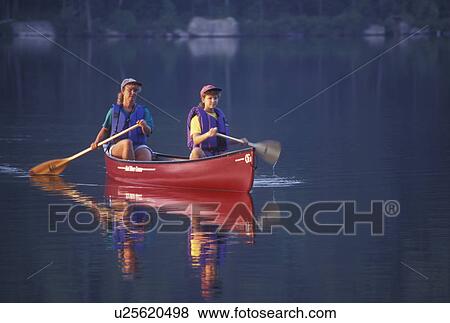 canoeing, canoe, Vermont, VT, Mother and daughter paddling a red canoe on Kettle Pond in Groton State Forest. View Large Photo Image Stock Photo - canoeing, canoe, Vermont, VT, Mother and daughter paddling a red canoe on Kettle Pond in Groton State Forest.. Fotosearch