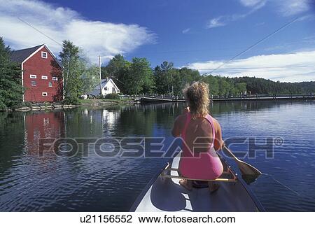 canoeing, canoe, Vermont, VT, Woman paddling a red canoe on Sunset Lake in Brookfield. View Large Photo Image Stock Image - canoeing, canoe, Vermont, VT, Woman paddling a red canoe on Sunset Lake in Brookfield. . Fotosearch