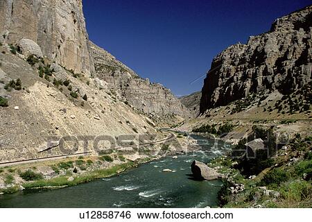 Stock Photograph -  canyon, Wyoming, WY, Water flows down through the Wind River Canyon near Shoshoni.. Fotosearch