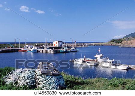 Stock Image -  Cape Breton, Nova Scotia, NS, Canada, Fishing boats docked in harbor on Pleasant Bay on the Gulf of St. Lawrence in Cape Breton. . Fotosearch