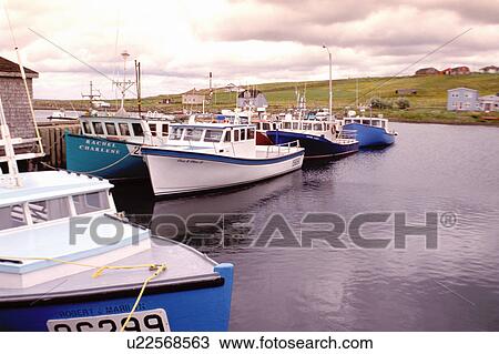 Stock Image -  Cape Breton, Nova Scotia, NS, Canada, Fishing boats docked in the harbor of Grand Etang an Acadian fishing community on the Gulf of St. Lawrence in Cape Breton. . Fotosearch