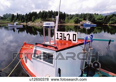 Cape Breton, Nova Scotia, NS, Canada, Red and blue lobster boats in Dingwall in Cape Breton. View Large Photo Image Stock Photo - Cape Breton, Nova Scotia, NS, Canada, Red and blue lobster boats in Dingwall in Cape Breton.. Fotosearch