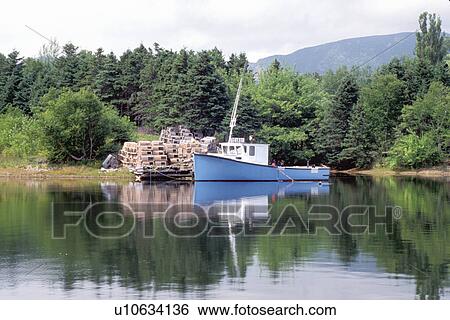 Cape Breton, Nova Scotia, NS, Canada, Blue lobster boat in Dingwall in Cape Breton. Lobster traps on dock. View Large Photo Image Stock Photograph - Cape Breton, Nova Scotia, NS, Canada, Blue lobster boat in Dingwall in Cape Breton. Lobster traps on dock.. Fotosearch