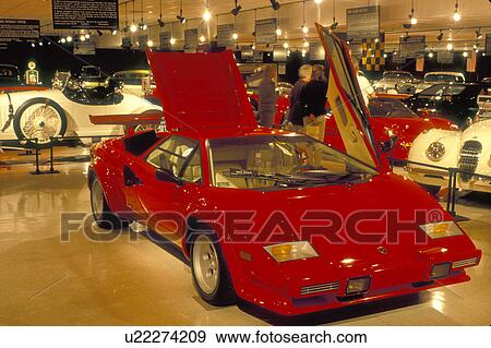 Stock Photo -  car, South Deerfield, Massachusetts, MA, A red 1984 Lamborghini Countach displayed inside Yankee Candle Car Museum at the Yankee Candle Company in South Deerfield in the autumn.. Fotosearch