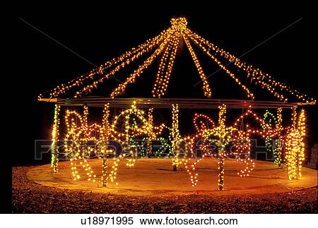 carrousel, Georgia, GA, Atlanta, Colorful Christmas lights decorate a carrousel of horses at Georgia's Stone Mountain Park. View Large Photo Image Stock Photography - carrousel, Georgia, GA, Atlanta, Colorful Christmas lights decorate a carrousel of horses at Georgia's Stone Mountain Park.. Fotosearch