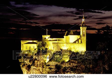 Stock Photograph -  castle, France, Rocamadour, Perigord, Dordogne, Midi-Pyrenees, Lot, Europe, The castle of the fortified pilgrimage town of Rocamadour above the limestone cliffs is illuminated at night. . Fotosearch