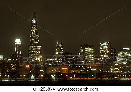 Picture -  Chicago, skyline, evening, Illinois, IL, Lake Michigan, Downtown skyline of Chicago from the Chicago Harbor in the evening on Lake Michigan.. Fotosearch