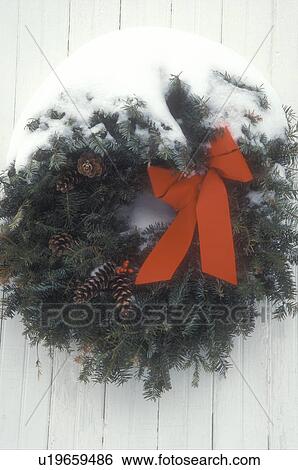 Christmas wreath, close-up, wreaths, bow, ribbon, red, holiday, decoration, winter, A snow covered Christmas wreath with a red bow hangs on a barn door in the state of Vermont. View Large Photo Image Stock Photograph - Christmas wreath, close-up, wreaths, bow, ribbon, red, holiday, decoration, winter, A snow covered Christmas wreath with a red bow hangs on a barn door in the state of Vermont.. Fotosearch