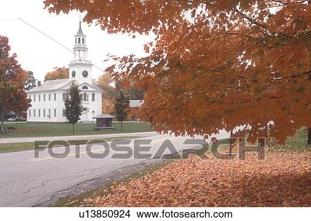 Picture -  church, fall, maple tree, East Poultney, VT, Vermont, Picturesque view of The United Baptist Church in autumn in East Poultney.. Fotosearch
