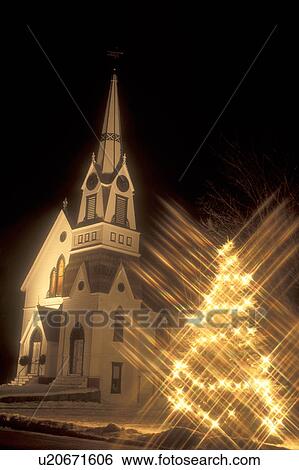 church, holiday, Christmas tree, decorations, outdoor, outside, snow, winter, White starlights decorate the evergreen tree outside the church in Ryegate Corner for the Christmas holiday season at night in Caledonia County in the state of Vermont. View Large Photo Image Stock Photograph - church, holiday, Christmas tree, decorations, outdoor, outside, snow, winter, White starlights decorate the evergreen tree outside the church in Ryegate Corner for the Christmas holiday season at night in Caledonia County in the state of Vermont. . Fotosearch