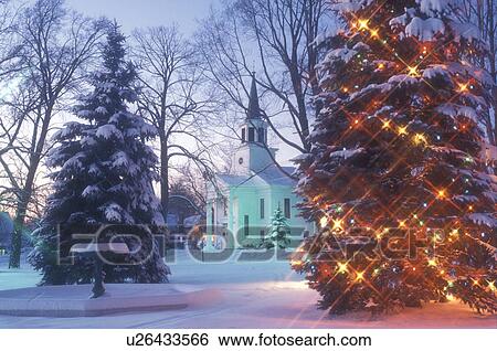 church, winter scene, chapel, christmas tree, decorations, village, town, winter scene, holiday, snow, Vermont, Picturesque view of The First Baptist Church of Bristol and a large evergreen tree on the Green decorated with sparkling colorful lights for t View Large Photo Image Stock Photograph - church, winter scene, chapel, christmas tree, decorations, village, town, winter scene, holiday, snow, Vermont, Picturesque view of The First Baptist Church of Bristol and a large evergreen tree on the Green decorated with sparkling colorful lights for t. Fotosearch