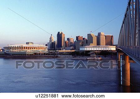 Cincinnati, skyline, stadium, bridge, OH, Ohio, Cinergy Field and downtown skyline of Cincinnati from the Taylor-Southgate Bridge crossing the Ohio River at sunrise. View Large Photo Image Stock Image - Cincinnati, skyline, stadium, bridge, OH, Ohio, Cinergy Field and downtown skyline of Cincinnati from the Taylor-Southgate Bridge crossing the Ohio River at sunrise. . Fotosearch