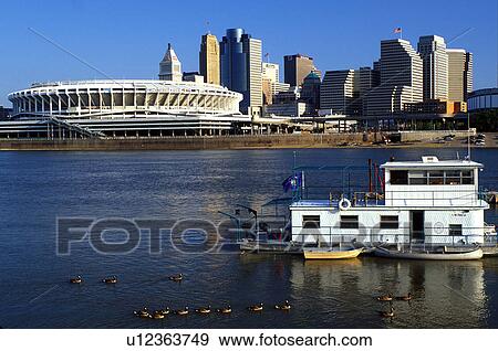 Cincinnati, stadium, skyline, OH, Ohio, Cinergy Field, home of the Cincinnati Reds, and downtown skyline of Cincinnati across the Ohio River. View Large Photo Image Stock Photo - Cincinnati, stadium, skyline, OH, Ohio, Cinergy Field, home of the Cincinnati Reds, and downtown skyline of Cincinnati across the Ohio River. . Fotosearch