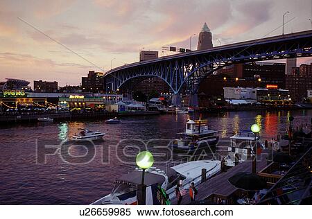Cleveland, OH, Ohio, Flats District, Main Avenue Bridge crosses the Cuyahoga River in the Flats District of downtown Cleveland in the evening. View Large Photo Image Stock Photography - Cleveland, OH, Ohio, Flats District, Main Avenue Bridge crosses the Cuyahoga River in the Flats District of downtown Cleveland in the evening.. Fotosearch