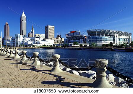 Stock Image -  Cleveland, OH, Ohio, Skyline of downtown Cleveland and Cleveland Browns Stadium along the waterfront of North Coast Harbor.. Fotosearch