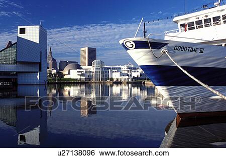 Stock Photograph -  Cleveland, skyline, hall of fame, OH, Ohio, Skyline of downtown Cleveland, Rock and Roll Hall of Fame and Museum, and Goodtime Cruise Lines along the waterfront of North Coast Harbor.. Fotosearch