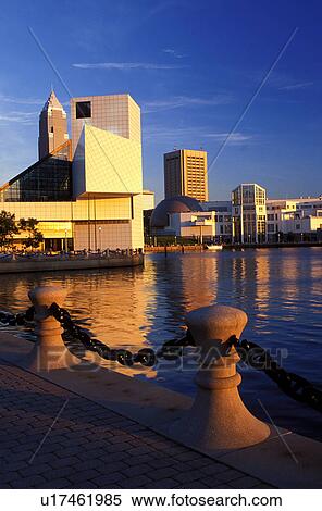 Stock Photography -  Cleveland, skyline, OH, Ohio, Skyline of downtown Cleveland and the Rock and Roll Hall of Fame and Museum along the waterfront of North Coast Harbor.. Fotosearch
